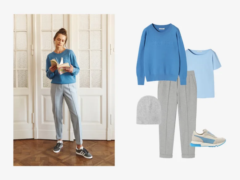 Modrá svetr s šedými kalhotami – stylizovaný outfit pro článek o barvách.