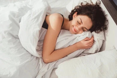 Sleeping woman in bed